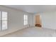 Bright and airy living room featuring plush carpeting and shuttered windows at 2685 Whippoorwill Cir, Duluth, GA 30097