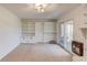 Living room features a fireplace, built-in shelves, and a door to the porch at 2685 Whippoorwill Cir, Duluth, GA 30097