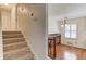 Staircase leading to a kitchen with shuttered window at 2685 Whippoorwill Cir, Duluth, GA 30097