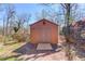 Outdoor storage shed in the backyard has double doors and is painted to match the house at 2685 Whippoorwill Cir, Duluth, GA 30097