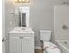 Clean bathroom featuring white fixtures and plenty of light at 3671 Satellite Blvd, Ellenwood, GA 30294