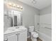 Clean bathroom featuring white fixtures and plenty of light at 3671 Satellite Blvd, Ellenwood, GA 30294