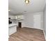 Clean kitchen with white cabinets and modern appliances, featuring stainless steel sink at 3671 Satellite Blvd, Ellenwood, GA 30294