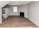 Living room with a fireplace, window and staircase at 3671 Satellite Blvd, Ellenwood, GA 30294