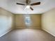 Bedroom with neutral carpet, a ceiling fan, and natural light from the window at 3756 Brookwood Blvd, Rex, GA 30273