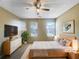 Serene bedroom with neutral tones, two windows, and modern furnishings in a virtually staged setting at 3756 Brookwood Blvd, Rex, GA 30273