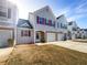 Charming two-story townhome with attached garage and well-maintained front lawn on a sunny day at 3756 Brookwood Blvd, Rex, GA 30273