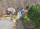 An aerial view showing the house with well-maintained landscaping and proximity to mature trees and the surrounding neighborhood at 1811 Penny Nw Ln, Lawrenceville, GA 30043