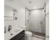 Modern bathroom featuring a walk-in shower with tiled walls and a sleek vanity with contemporary fixtures at 1811 Penny Nw Ln, Lawrenceville, GA 30043