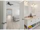 Bright bathroom featuring a double vanity with marble countertop, wooden floors and an open doorway to the bedroom at 1811 Penny Nw Ln, Lawrenceville, GA 30043