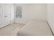 Clean bedroom with wood-look flooring, closet, and window, providing a tranquil retreat at 1811 Penny Nw Ln, Lawrenceville, GA 30043
