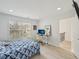 Inviting bedroom featuring natural light, wood-look flooring, and a workstation for studying or remote work at 1811 Penny Nw Ln, Lawrenceville, GA 30043
