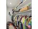 Walk-in closet with organized clothing racks and shelving, maximizing storage space at 1811 Penny Nw Ln, Lawrenceville, GA 30043