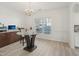 Dining room with modern lighting, large window, and contemporary furniture at 1811 Penny Nw Ln, Lawrenceville, GA 30043