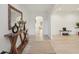 Inviting foyer featuring light wood floors, stylish console table, and an arched doorway at 1811 Penny Nw Ln, Lawrenceville, GA 30043