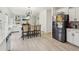 Bright, open kitchen with a breakfast bar, stainless steel appliances, and seamless access to the living room at 1811 Penny Nw Ln, Lawrenceville, GA 30043