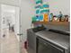 Functional laundry area showcasing modern washer/dryer, ample storage shelves, and convenient layout for efficient chores at 1811 Penny Nw Ln, Lawrenceville, GA 30043