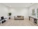 Spacious living room with neutral decor, ample seating, and natural light at 1811 Penny Nw Ln, Lawrenceville, GA 30043