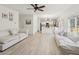 Open-concept living area flowing into a kitchen, featuring light wood flooring and neutral tones at 1811 Penny Nw Ln, Lawrenceville, GA 30043