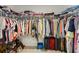 Spacious walk-in closet with ample storage, shelving, and hanging space for organization and convenience at 1811 Penny Nw Ln, Lawrenceville, GA 30043