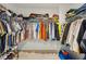 This large walk-in closet features ample shelving and racks for a well organized space at 1811 Penny Nw Ln, Lawrenceville, GA 30043