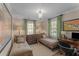 Guest bedroom with natural light, two beds, and desk at 208 Jefferson Cir, Atlanta, GA 30328