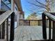 Spacious wooden back deck with dark railing offers a relaxing outdoor space at 3511 Flint Ave, Ellenwood, GA 30294