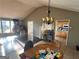 Bright open-concept living space with views of the kitchen and hardwood floors at 3511 Flint Ave, Ellenwood, GA 30294