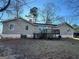 View of the back of the home with a back deck and siding at 3511 Flint Ave, Ellenwood, GA 30294