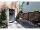 A compact backyard patio with seating area surrounded by trees and a privacy fence at 4323 E Durham Cir, Stone Mountain, GA 30083