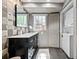 Sleek bathroom with a modern vanity, wall-mounted mirror, and a stackable washer/dryer at 4323 E Durham Cir, Stone Mountain, GA 30083
