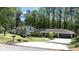 Charming homes with well-maintained lawns, mature trees, and inviting driveways showcase excellent curb appeal at 4323 E Durham Cir, Stone Mountain, GA 30083