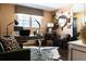 Inviting home office with zebra hide rug, large desk, and art at 4323 E Durham Cir, Stone Mountain, GA 30083