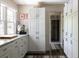 Bright, modern kitchen featuring white cabinetry, stainless steel appliances, and a marble backsplash at 4323 E Durham Cir, Stone Mountain, GA 30083