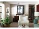 Bright living room with a modern display cabinet, comfortable chairs, and stylish décor at 4323 E Durham Cir, Stone Mountain, GA 30083