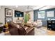 Living room boasts modern decor, a large TV, and comfortable seating at 4323 E Durham Cir, Stone Mountain, GA 30083
