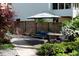 Beautiful patio featuring stylish outdoor furniture, privacy fence, and lush landscaping creating a relaxing backyard retreat at 4323 E Durham Cir, Stone Mountain, GA 30083