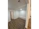 Finished basement area with stylish flooring and white trim at 2041 Olive Springs Se Rd, Marietta, GA 30060