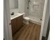 Bathroom featuring a vanity and walk-in shower with white and gray marble style tiling at 2041 Olive Springs Se Rd, Marietta, GA 30060