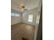 Bright bedroom featuring wood-look floors, a ceiling fan and white walls at 2041 Olive Springs Se Rd, Marietta, GA 30060