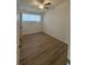 Bedroom features wood-look flooring and a ceiling fan at 2041 Olive Springs Se Rd, Marietta, GA 30060