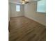 Bedroom featuring neutral walls, a ceiling fan, and two windows for natural light at 2041 Olive Springs Se Rd, Marietta, GA 30060