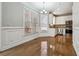 Bright dining area with wainscotting, wood floors, and natural light at 385 Sweet Ivy Ln, Lawrenceville, GA 30043