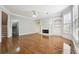 Spacious living room features built-in shelving, fireplace, and hardwood floors at 385 Sweet Ivy Ln, Lawrenceville, GA 30043