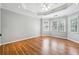 The main bedroom has tray ceiling, hardwood floors and plenty of natural light at 385 Sweet Ivy Ln, Lawrenceville, GA 30043