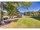Expansive backyard featuring a large shed, mature trees, and lush green grass at 441 Pumpkinvine Rd, Acworth, GA 30101