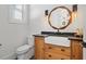 Charming powder room with a unique mirror, farmhouse sink, and stylish fixtures at 441 Pumpkinvine Rd, Acworth, GA 30101