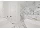 Modern bathroom featuring a soaking tub, marble shower, and dual vanities at 441 Pumpkinvine Rd, Acworth, GA 30101