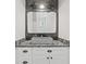 Stylish bathroom with decorative mirror, stone countertop, and vessel sink at 441 Pumpkinvine Rd, Acworth, GA 30101