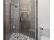 Modern bathroom with glass shower, geometric tile, and dark metal fixtures at 441 Pumpkinvine Rd, Acworth, GA 30101